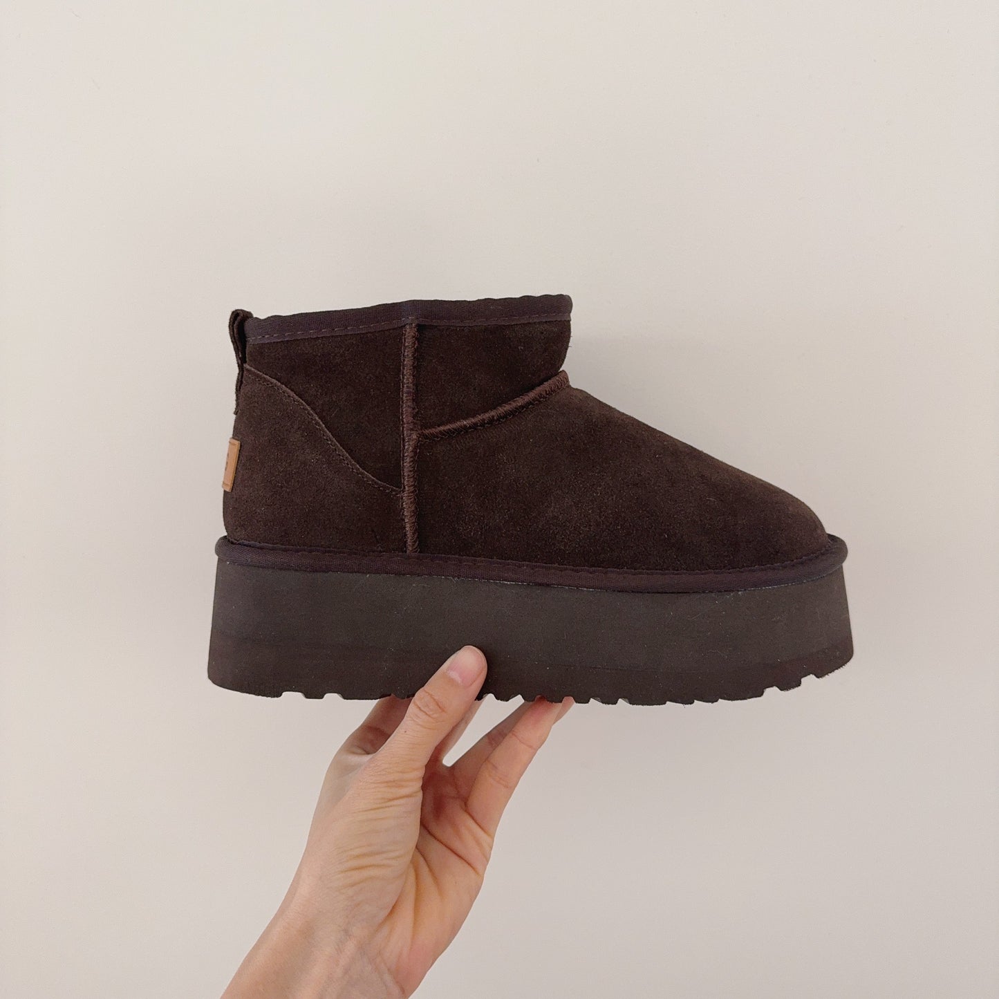 New ultra-high sole snow boots have a shoe box