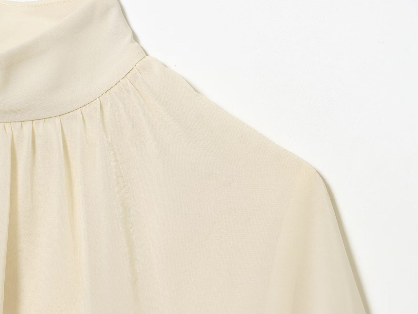 Women's new short layered decorative long sleeved top