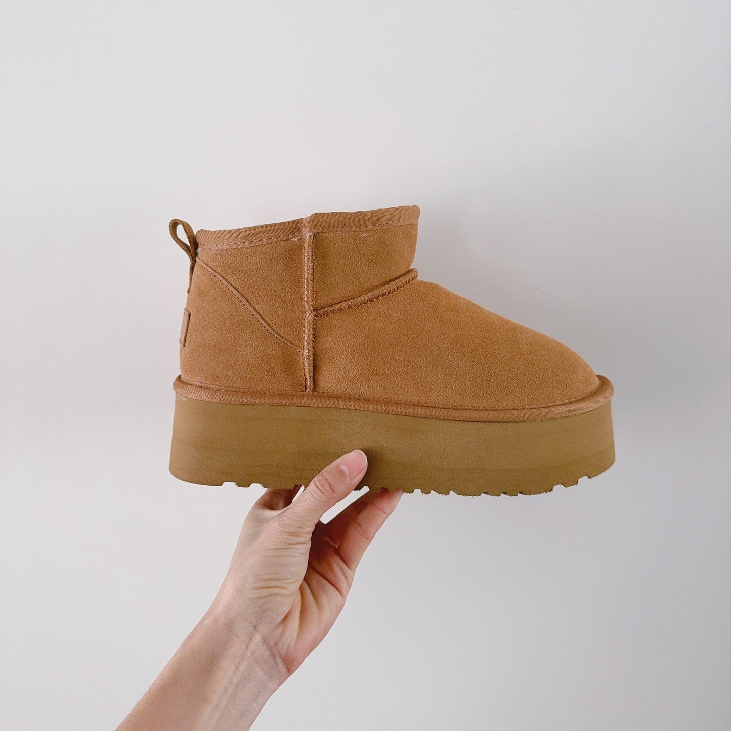 New ultra-high sole snow boots have a shoe box